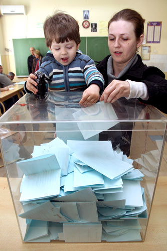 http://www.iso.org/iso/woman-and-child-at-early-parliamentary-elections-in-serbia.jpg