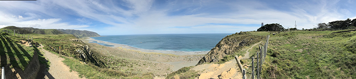 This is a panoramic view from a trail near the Baring Head/Ōrua-pouanui clean air monitoring station in New Zealand overlooking Cook Strait/Raukawa Moana. 