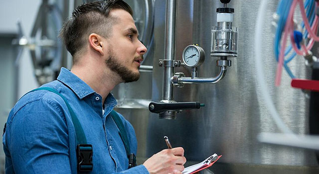 man monitoring gauges
