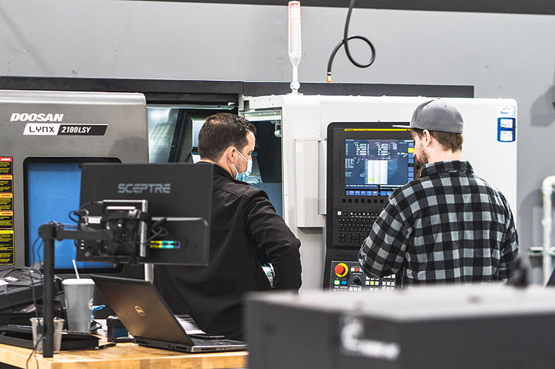 2 machinists at Halcyon machine shop